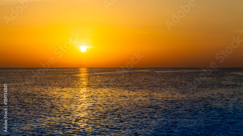 sunset over ocean. Sunset on the beach with beautiful sky. Dramatic sunset