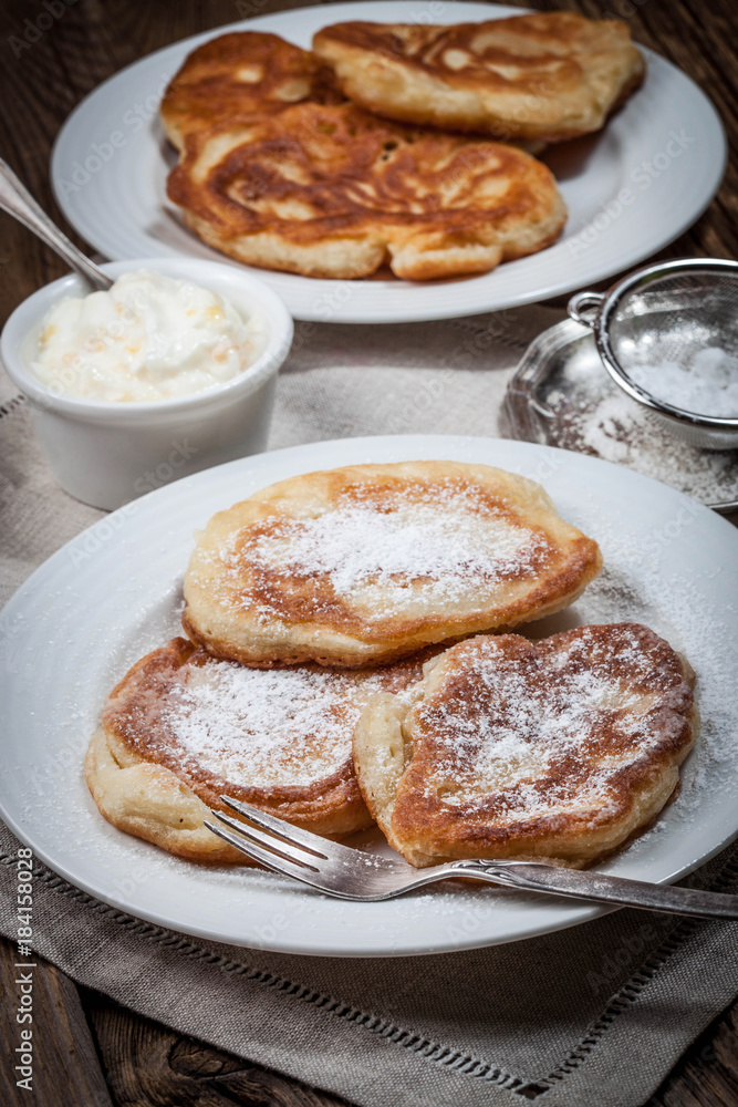 Polish pancakes with powdered sugar.