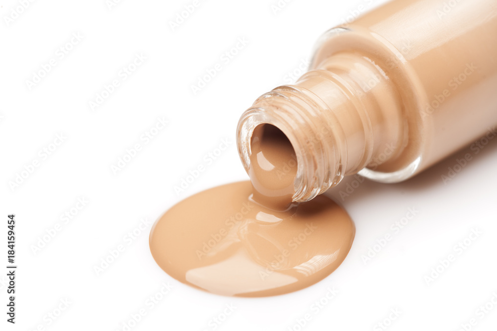 a glass bottle and a liquid base that is drawn from it a glass bottle and a liquid base that is drawn from it