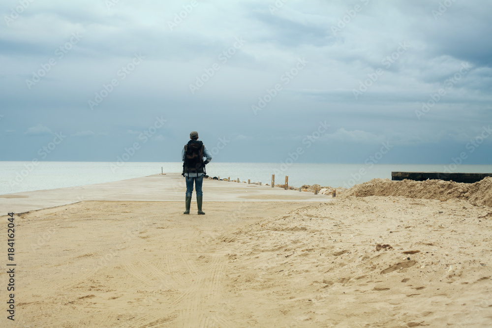 A lone explorer discovering an amazing pier by the sea, in the middle of nowhere.
A lone explorer discovering an amazing pier by the sea, in the middle of nowhere.