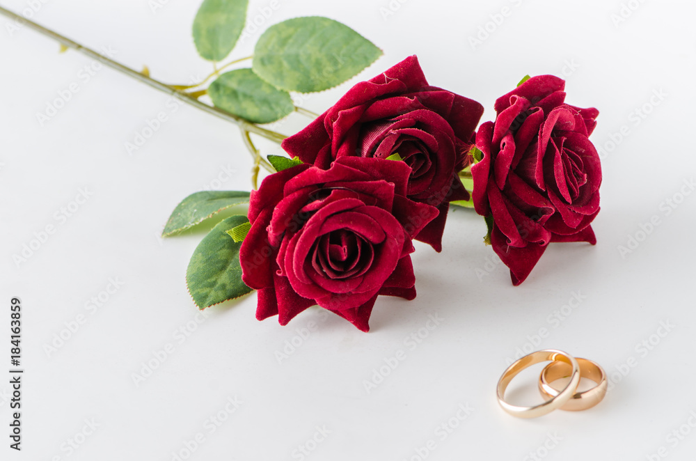Wedding concept with rings and roses Wedding concept with rings and roses