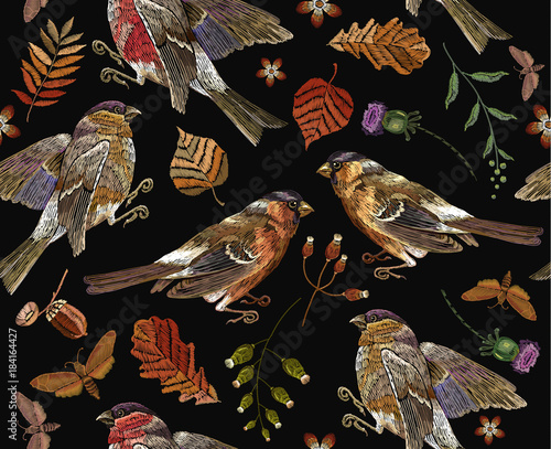 Classical september embroidery autumn leaves, bullfinch and titmouse. Embroidery autumn and birds seamless pattern. Fashionable template for design of clothes, t-shirt design