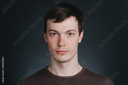 Portrait of man closeup in Studio on dark background