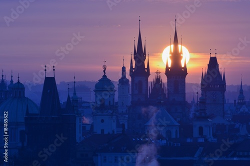 Sun disk behind spire of the Prague Church of Our Lady before Tyn