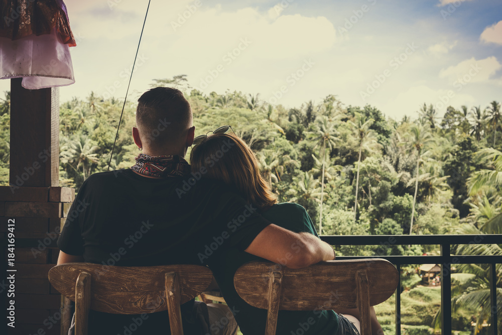 Young romantic honeymoon couple in the jungle rainforest of a tropical island of Bali, Indonesia.