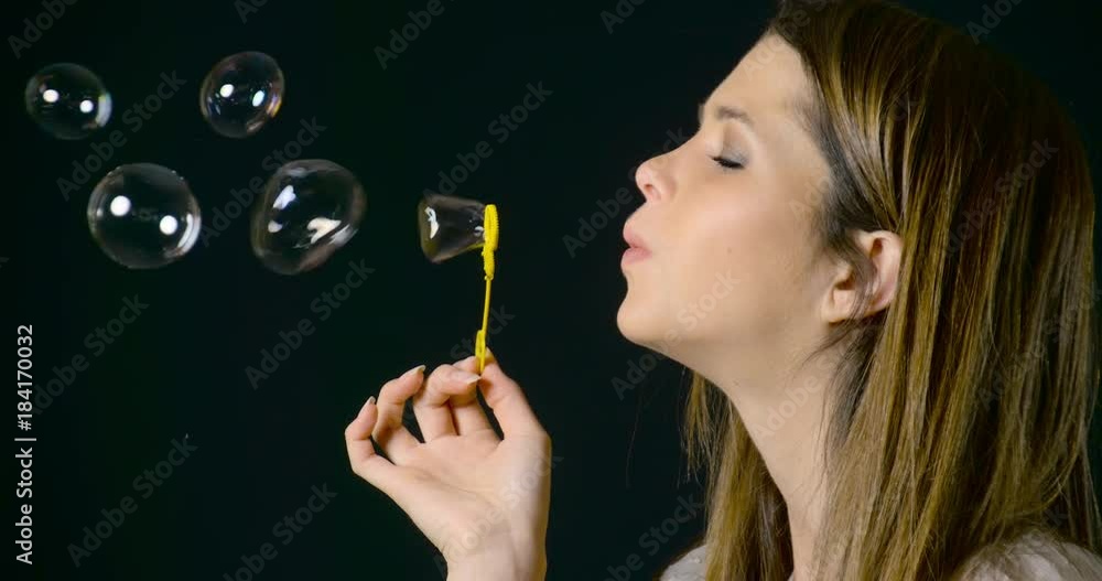 Pretty Woman Blowing Bubbles. Slow Motion. Pretty Woman Blowing Bubbles. Slow Motion.