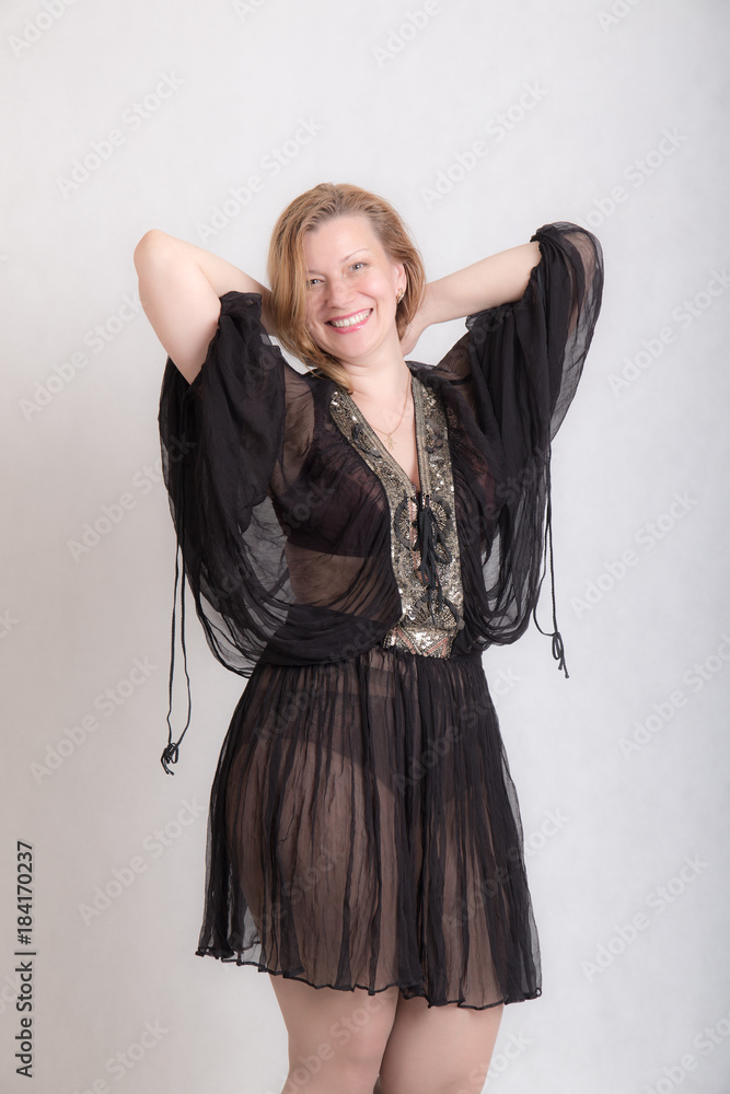 cheerful woman in a black dress cheerful woman in a black dress