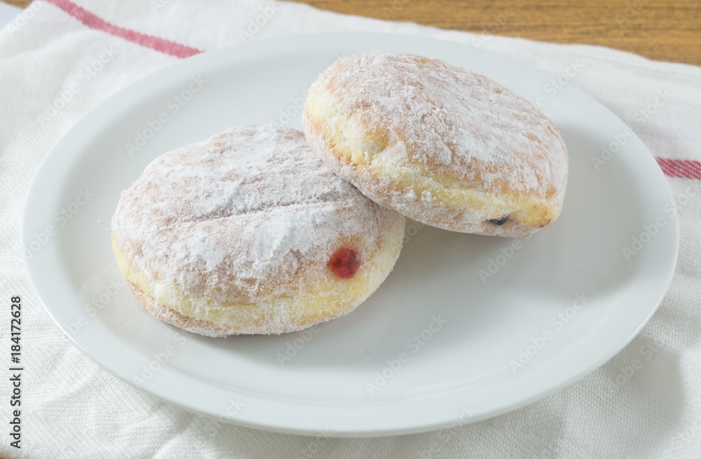 Plate of Fresh Donut Filled with Strawberry Jam