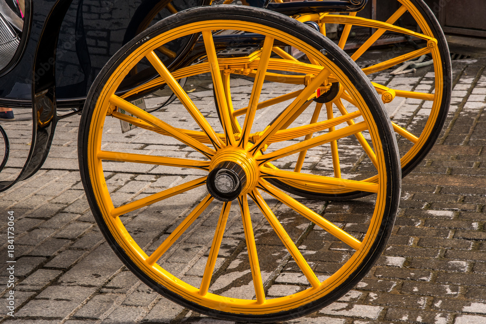 Old yellow cart wheel