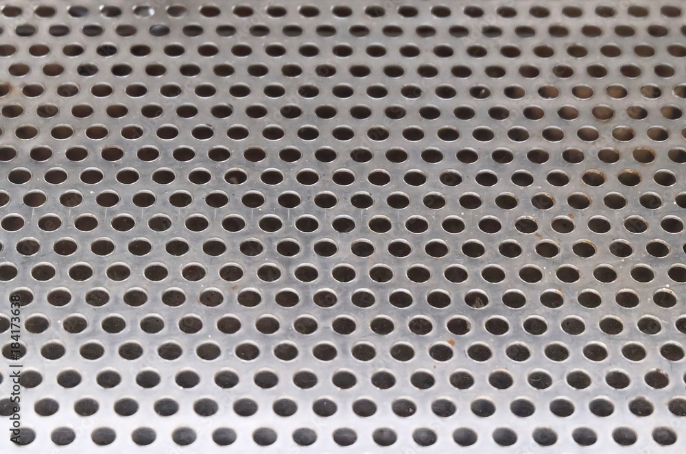 Texture Background of Matalic Silver Perforated Grid Texture Background of Matalic Silver Perforated Grid
