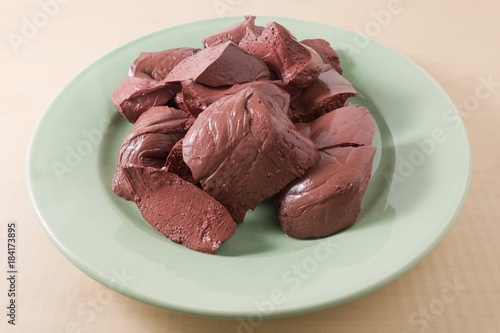 Boiled Pig Blood Curd on A Green Dish photo