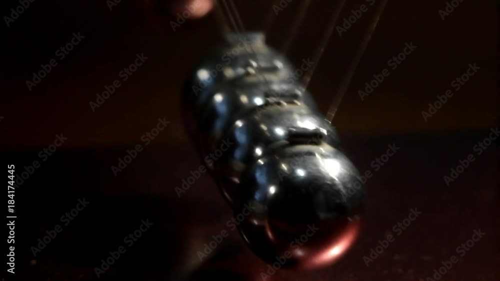 the motion of balls in Newton's pendulum, macro the motion of balls in Newton's pendulum, macro