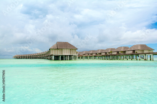Wooden villas over water of the Indian Ocean  Maldives