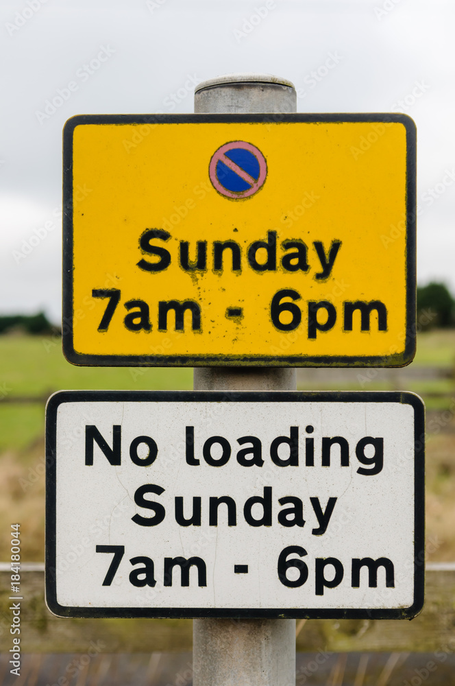 Sign advising motorists that there is no parking in this area on Sundays from 7am to 6pm. Sign advising motorists that there is no parking in this area on Sundays from 7am to 6pm.