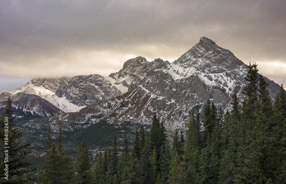 Snowy Mountain Rae Top Landscape View and Stormy Low Clouds from Great Hiking Trail to Tombstone Lakes in Kananaskis Country near Banff National Park Canadian Rocky Mountains