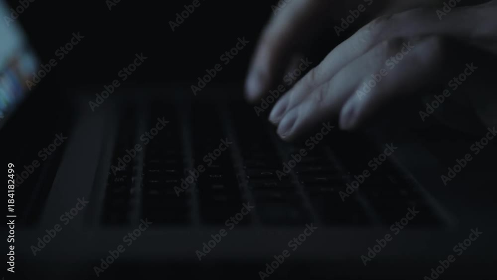 Night business man man: looking at a website work on laptop close up Night business man man: looking at a website work on laptop close up