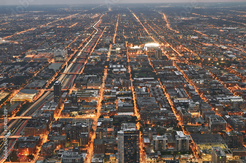 Chicago cityscape during sunset at night. Taken from above at Skydeck Willis Tower. Railroad in sight