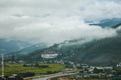 View of Rinpung Dzong on a dramatically cloudy day in Paro valley, Bhutan