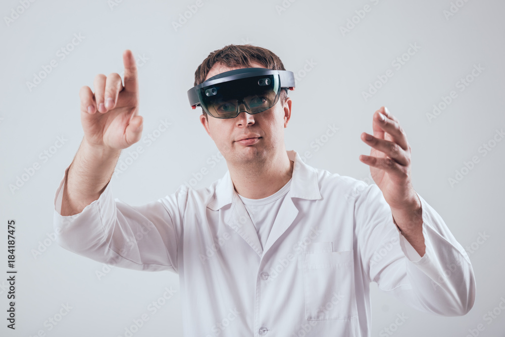 Doctor uses augmented reality goggles. Doctor uses augmented reality goggles.