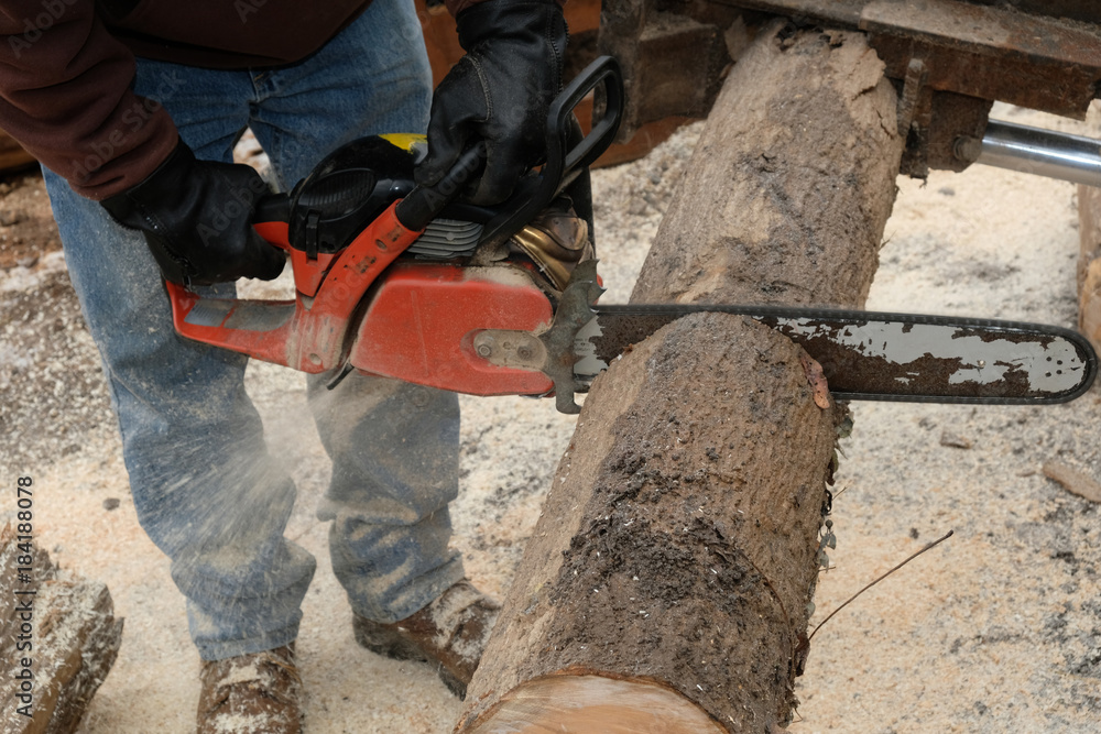 Cutting through a log with a chainsaw 2 Cutting through a log with a chainsaw 2