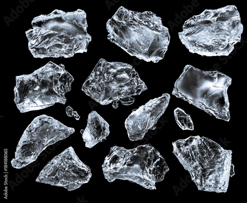Set of crushed ice cubes on black background, isolated on black. Clipping path for each piece.