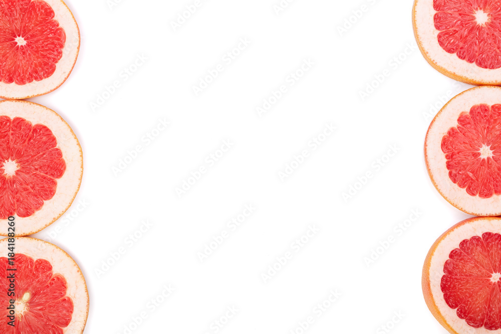 Grapefruit slices isolated on white background with copy space for your text. Top view. Flat lay pattern Grapefruit slices isolated on white background with copy space for your text. Top view. Flat lay pattern