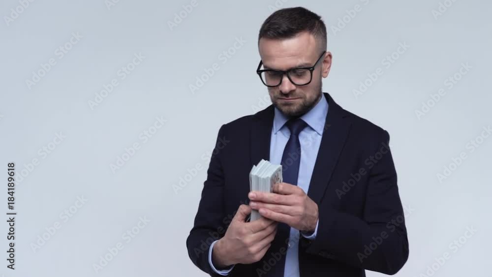 Funny concept of financial corruption - a formally dressed man receives a bribe and hides. Slow motion Funny concept of financial corruption - a formally dressed man receives a bribe and hides. Slow motion