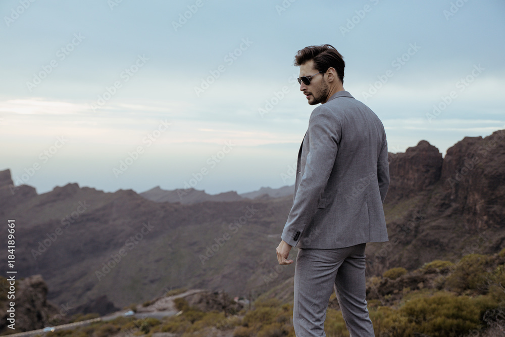 Young businessman realxing and looking at the nature Young businessman realxing and looking at the nature