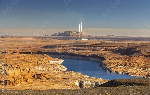 Lake Powell and Colorado River Landscape near Glenn Canyon Dam with Distant Coal Fired Navajo Power Plant Electricity Generating Station in Page Arizona