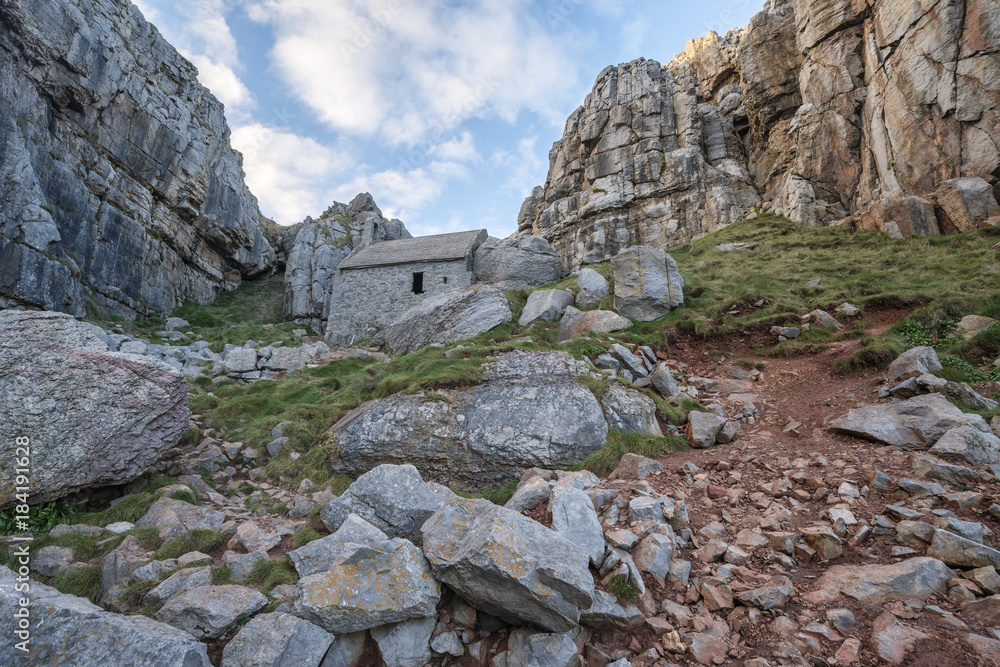 Stunning landscape image of St Govan's Chapel on Pemnrokeshire Coast in Wales