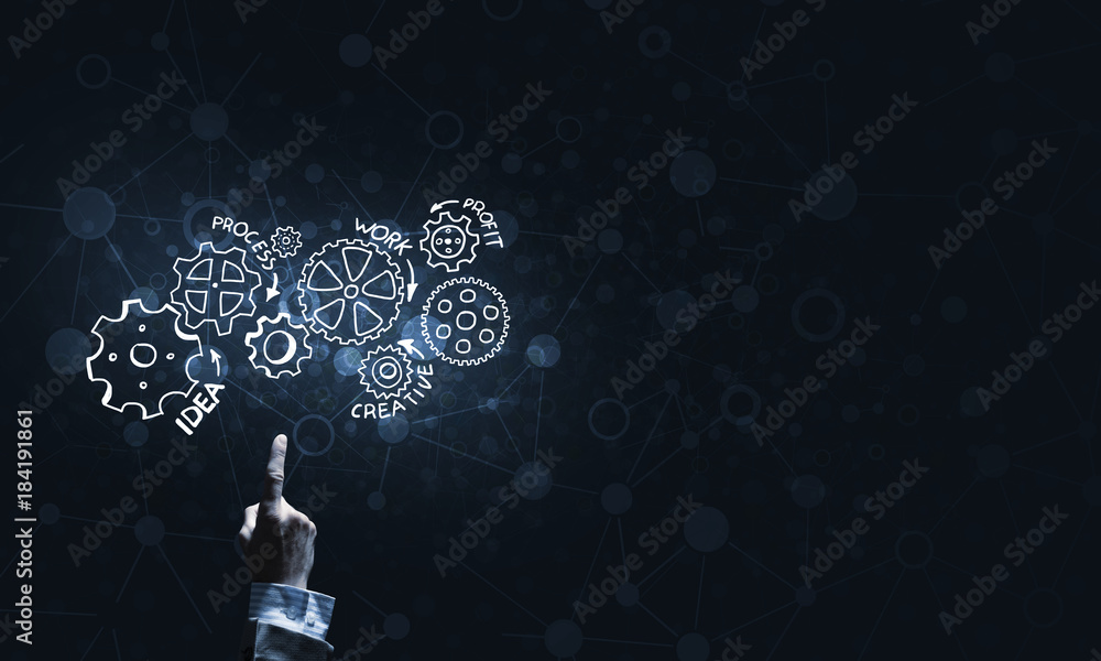 Glowing cogwheel mechanism icon on dark background as symbol of teamwork Glowing cogwheel mechanism icon on dark background as symbol of teamwork