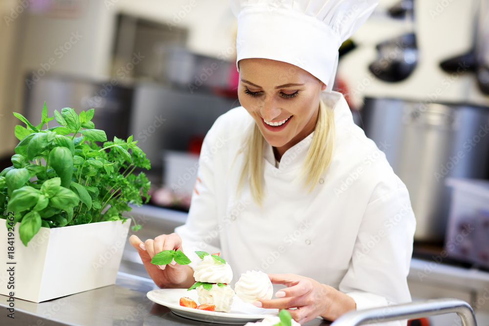Busy chef at work in the restaurant kitchen