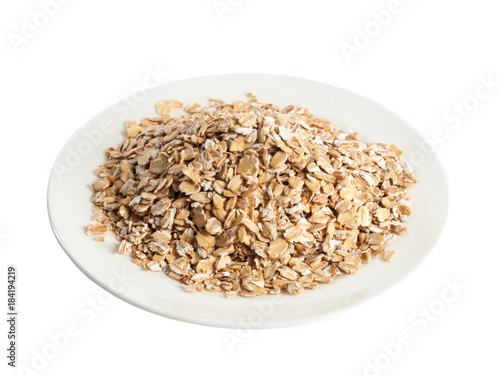 Plate with oat flakes high angle of view isolated on white