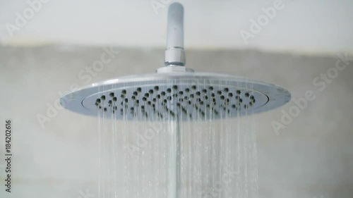 Home shower head closeup, raindrop flow model, spilling water