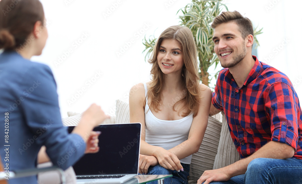 Young happy couple at therapy session with family psychologist Young happy couple at therapy session with family psychologist