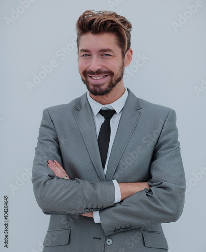Portrait of a smiling handsome business man over white backgrou