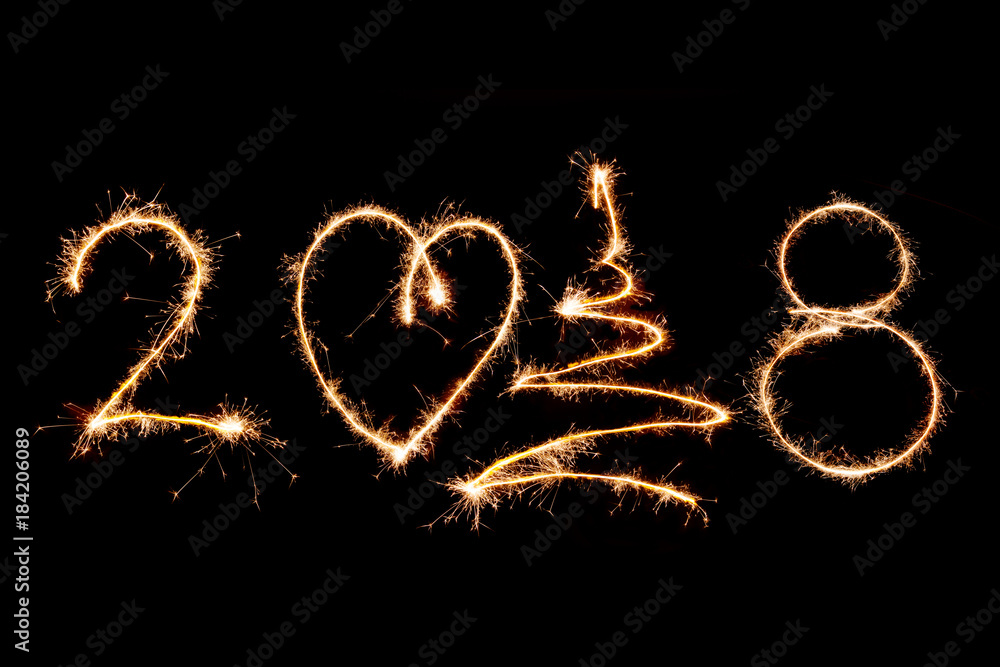 2018 written with Sparkle firework on black background, happy new year 2018 concept 2018 written with Sparkle firework on black background, happy new year 2018 concept
