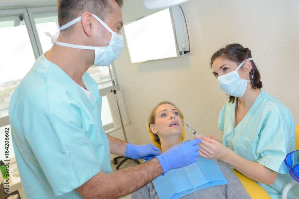 dentist and assistant dentist and assistant