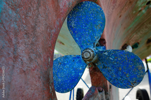 Fotografia Blue propeller on the hull of a steel fishing boat