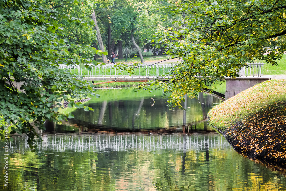 River and autumn trees in a quiet park. River and autumn trees in a quiet park.