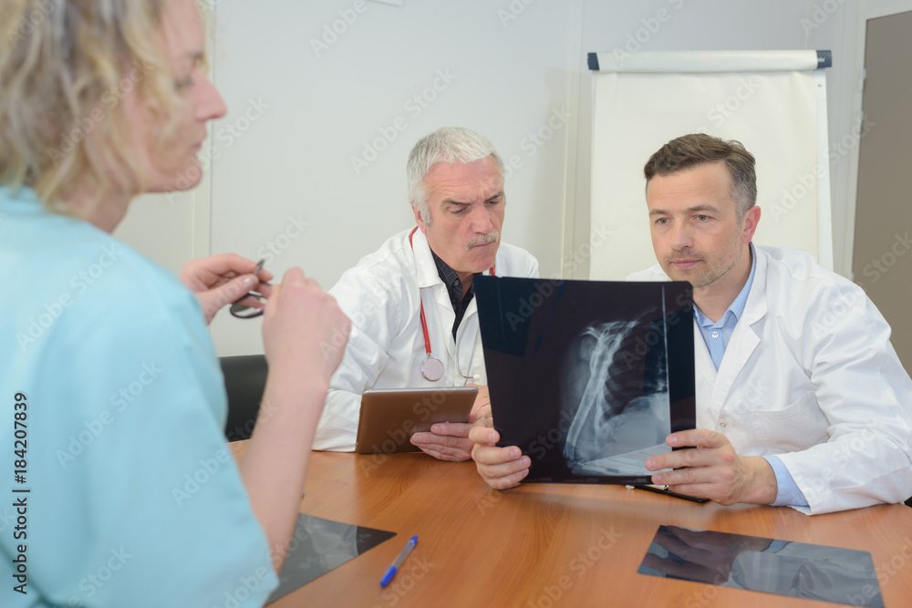 doctors looking at x-ray doctors looking at x-ray