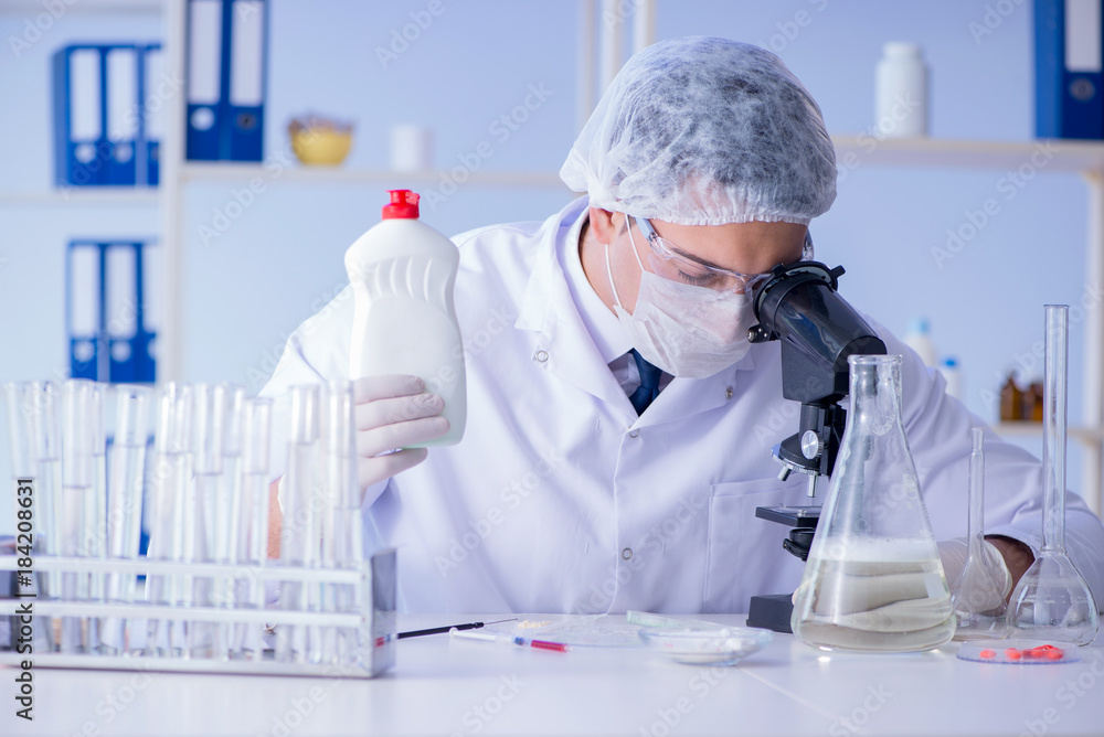 Man in the lab testing new cleaning solution detergent Man in the lab testing new cleaning solution detergent