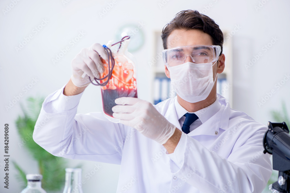 Doctor working with blood samples in hospital clinic lab Doctor working with blood samples in hospital clinic lab