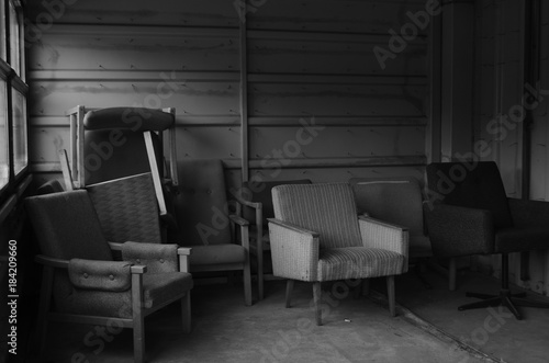 Chairs in abandoned botel B&W photo