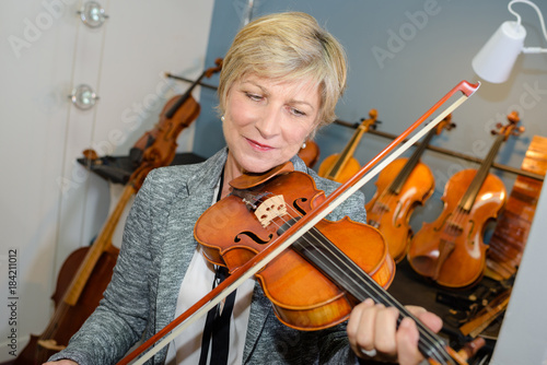 Senior lady playing violin