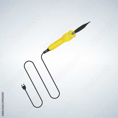 Soldering iron with a yellowhandle. Electronic equipment.