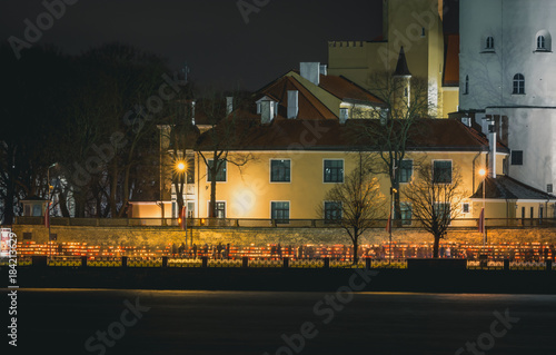 Latvian patriots lighting candles as a tribute to fallen freedom fighters. An annual remembrance day in 11th of November © Viesturs