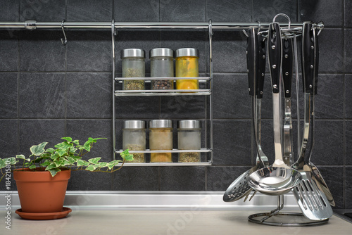 Jars of spices in hanging shelf