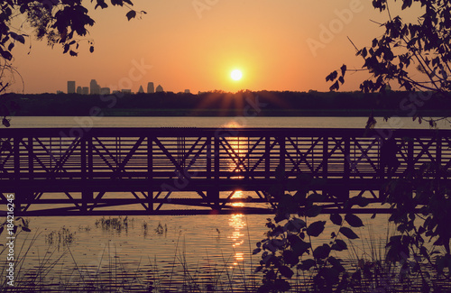 sunset over thebridge and lake with business buildings in Dallas city, Texas photo