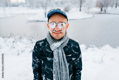 Fotografija Closeup portrait of male face covered with snow